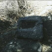 Rock placed under head of the stamper, jhandar, and dhenki, Erandol, Maharashtra, India, 1985