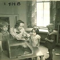 Children and teacher with pet rodent, The University of Iowa, January 12, 1938